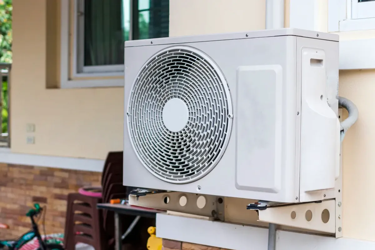 Outdoor heat pump unit on a wall bracket